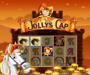 Jollys Cap Jackpot Slot Machine Der Clown Jolly sitzt auf einem Glücksspielautomat. Vor ihm liegen viele Goldmünzen als Gewinn und ein weißes fröhliches Pferd steht davor